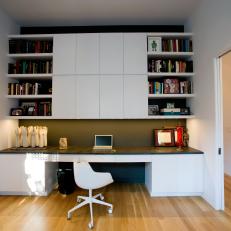 Modern Home Office With Built-In Storage and Pocket Doors
