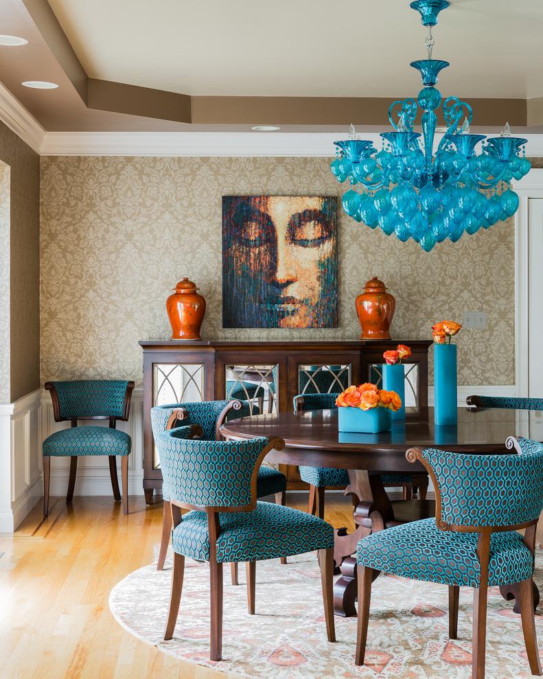 Transitional Dining Room With Orange Accents and Aqua Chandelier