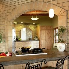 Kitchen With Stone Block Arched Doorway