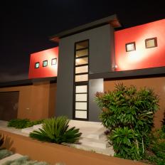 Modern Red-and-Black House Exterior at Night