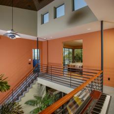 Second Floor of Modern Home With Orange Wall and Clerestory Windows