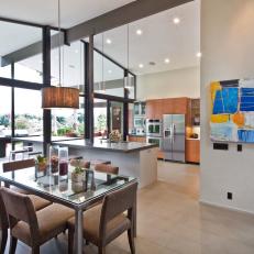 Modern Kitchen with Indoor/Outdoor Island and Glass Dining Table