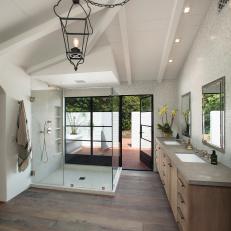 Open and Airy Contemporary Bathroom Leads to Patio 