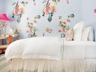 White Bed With Photos on Walls