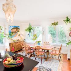 Eat-in Kitchen with Country-style Kitchen Table and Chairs, Formal Chandeliers and Mexican Tile Floors