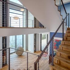Contemporary Staircase With Sleek Metal Railing