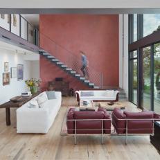 Light-Filled Living Room Boasts Rich Red Accent Wall
