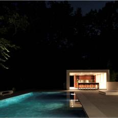 White Modern Bar Cabana and Pool at Night