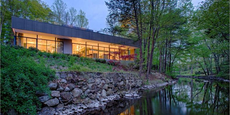 Modern Gray Home With Views of River