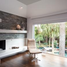 Gray and White Contemporary Master Bedroom With Fireplace