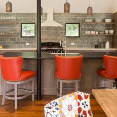 Vibrant Orange Barstools Energize Farmhouse Kitchen
