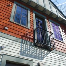Blue Tudor Home Exterior With Shingles