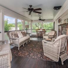 Country Screened Porch With Lovely Wicker Furniture