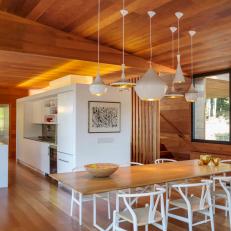 Neutral Modern Wood-Paneled Dining Room and Kitchen 