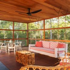 Screened-In Rustic Porch With Porch Swing