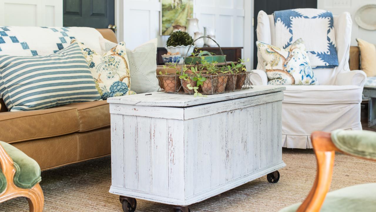 Antique wood trunk or chest used as a coffee table in a living area.  Beautiful! Rustic farmho…