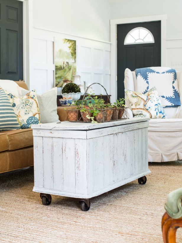 Old wooden trunks are stowed away in many attics and often end up in yard sales or thrift stores at a great price.  Give one of them an update by simply adding casters to make it a functional (and mobile) coffee table.