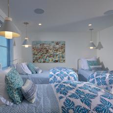 Bedroom Features Twin Beds With Blue Patterned Bedding