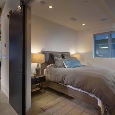 Simple Bedroom With Neutral Color Palette and Sliding Doors