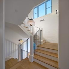 Bright Staircase With White Painted Brick Wall
