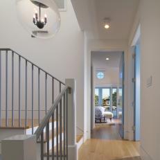 Bright, Contemporary Hallway With Glass Globe Light