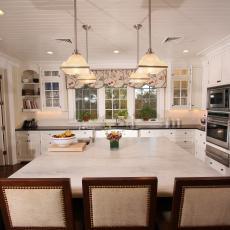 Bright, Traditional Kitchen With Marble-Topped Island