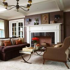 Rich Brown Living Area With Neutral & Orange Accents