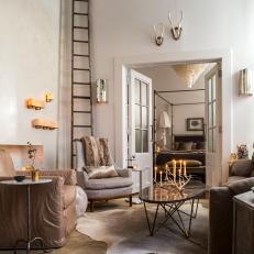 Chic, Eclectic Living Room With Antler Candelabra & Cowhide Rug