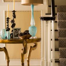 Transitional Foyer Features Gold Table With Hoofed Legs