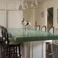White Kitchen Island Features Green Tile Countertop