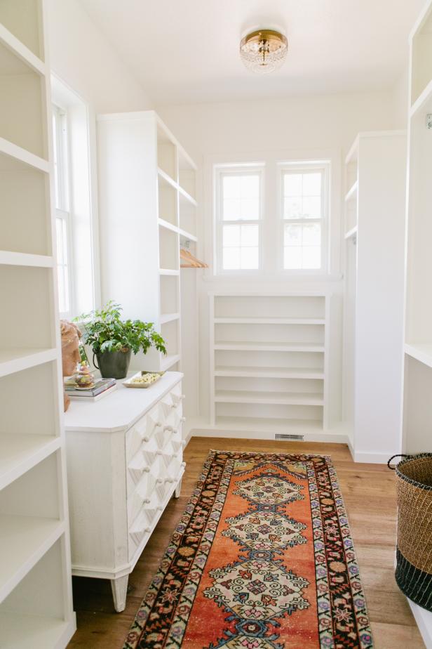 White Transitional Walk-In Closet With White Shelves & Dresser