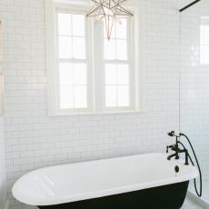 Master Bath Features Black & White Clawfoot Bathtub