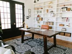Transitional Home Office With White Bookcases & Black French Doors
