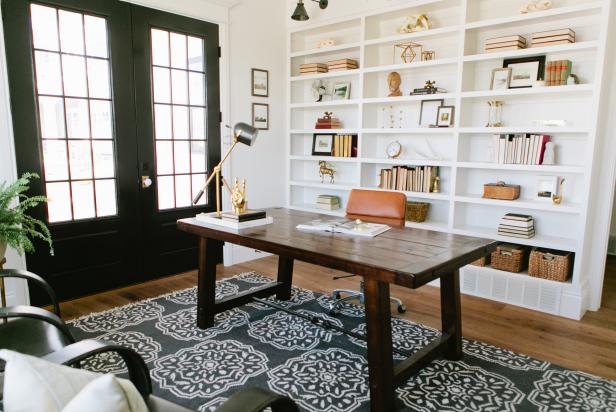 Transitional Home Office With White Bookcases & Black French Doors
