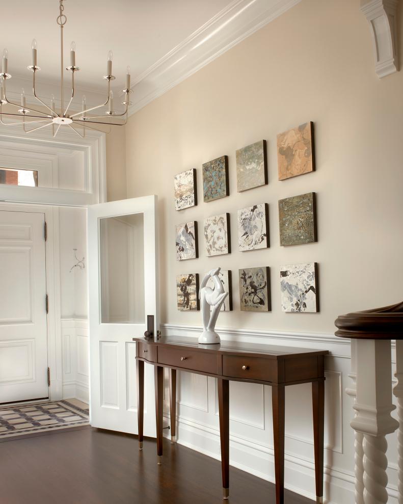 Neutral Transitional Entry With Metal Chandelier & Brown Console Table