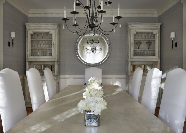 Gray Dining Room With Beige Dining Table and White Upholstered Chairs