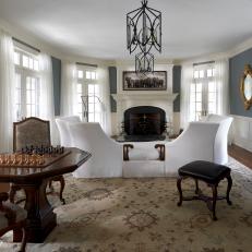 Traditional Living Room Features Game Table and Piano