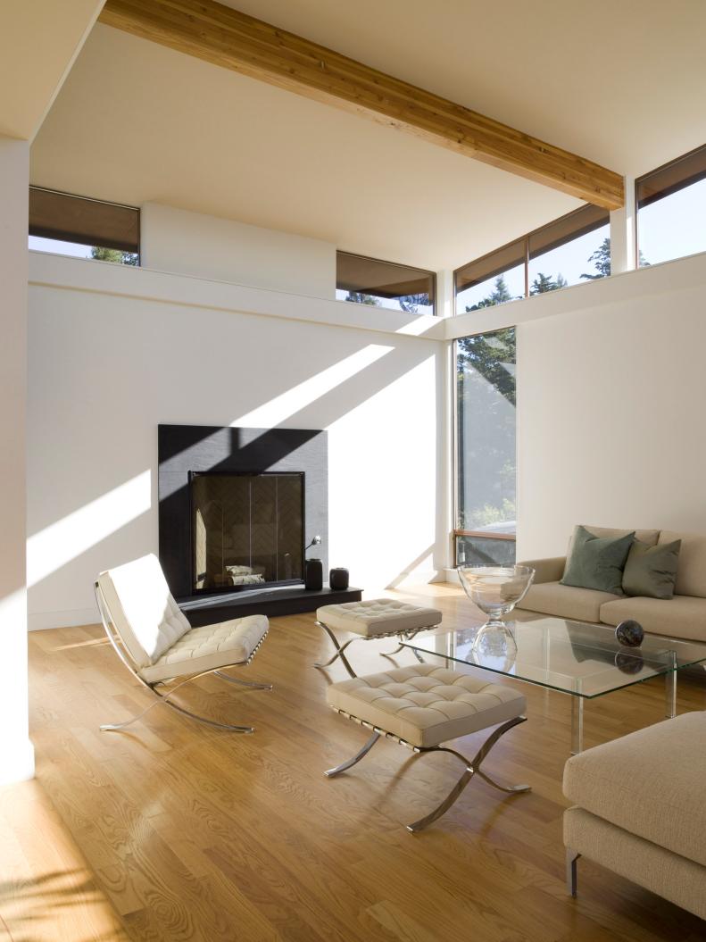 Modern White Living Room With Ceiling Beam and Clerestory Windows