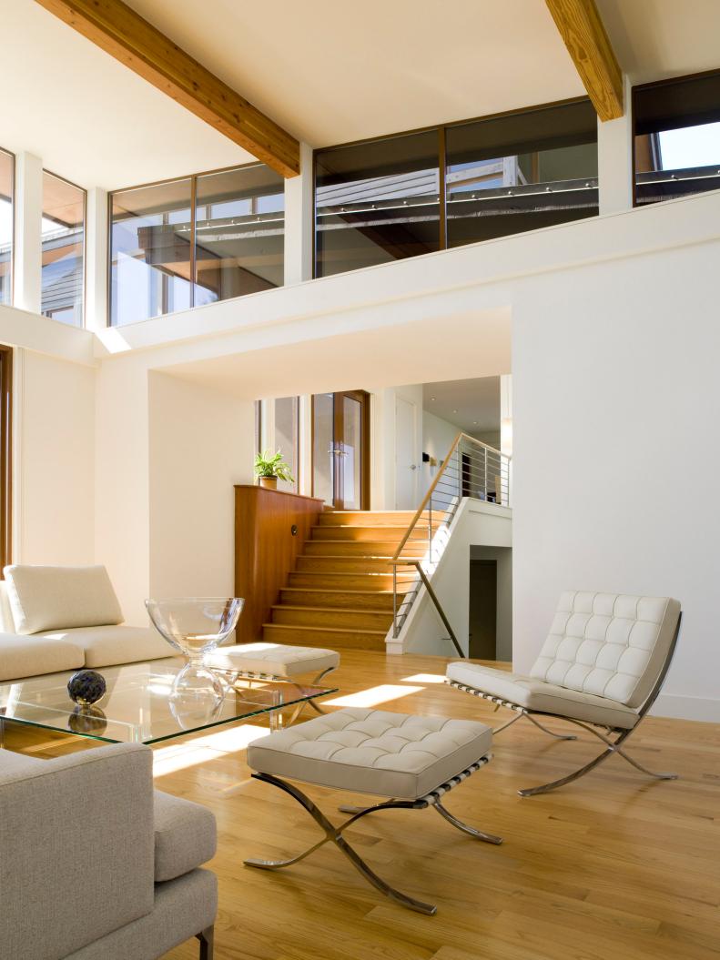 Modern White Living Room With Wood Floors and Neutral Furniture