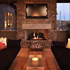 Chic Southwestern Covered Patio with Stone Fireplace