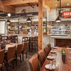 Restaurant Dining Room and Kitchen with Subway Tiles, Long Wood Tables and Dining Bars