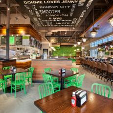 Contemporary Brown and Green Interior of Wahlburgers 