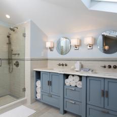 Bathroom Features Blue Double Vanity & Walk-In Shower