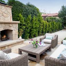 Outdoor Living Room with Stone Floor and Fireplace 