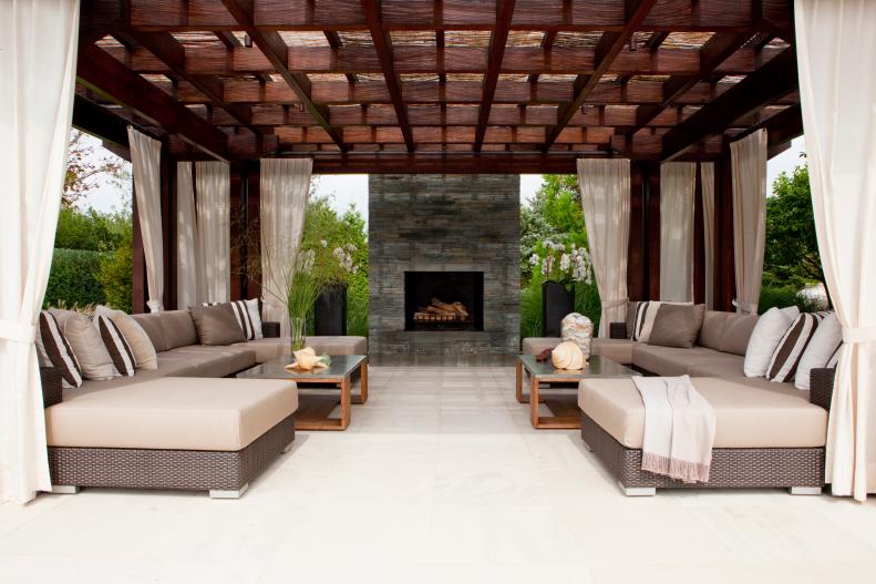 Relaxing Outdoor Oasis with Custom Arbor and Stone Fireplace 