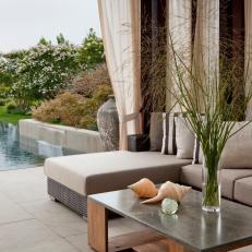 Poolside Outdoor Living Room Boasts Sleek Furniture 