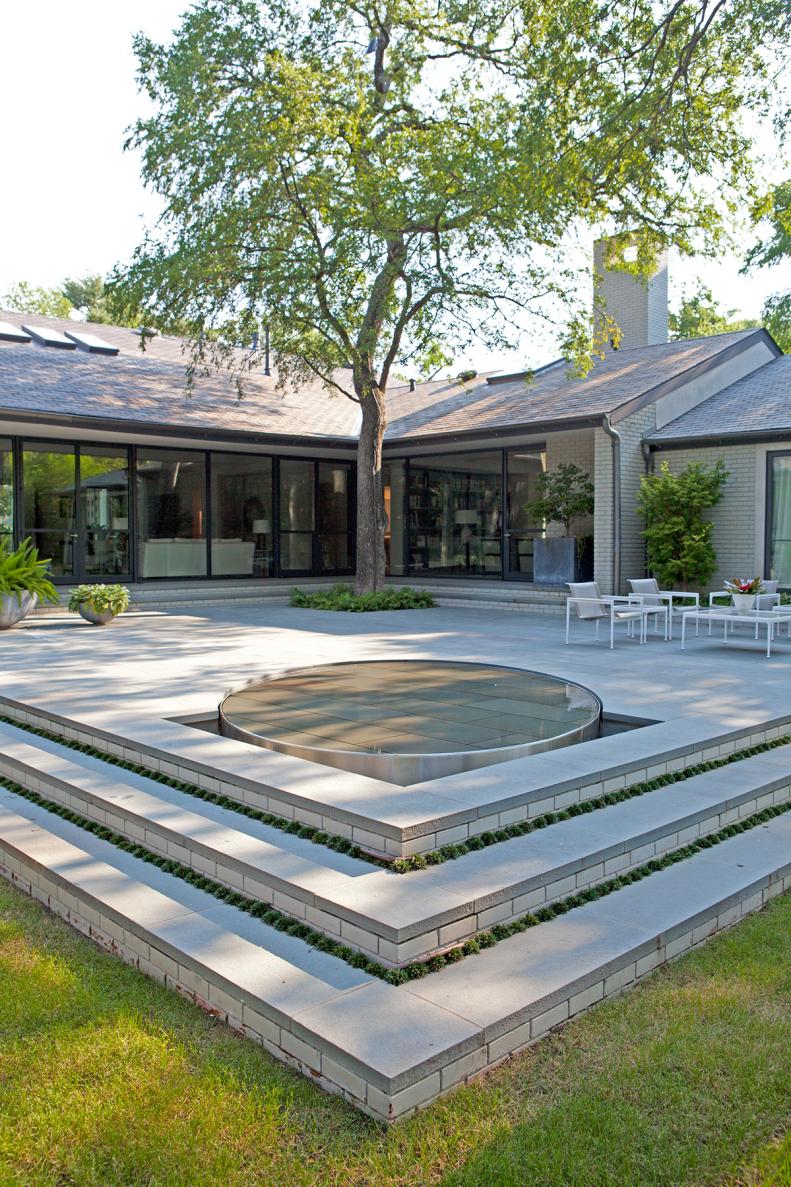 Contemporary Patio With Water Feature and Tree