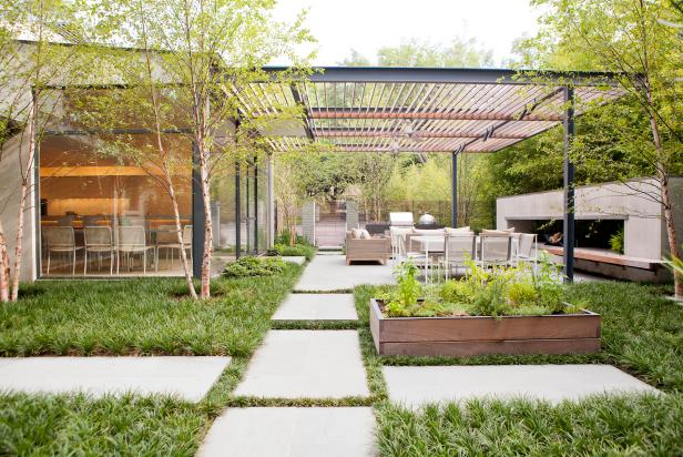 Modern Outdoor Space With Pergola and Raised Herb Planter