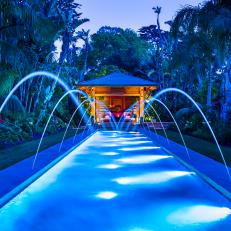 Gorgeous Lap Pool With Underwater Lights and Rows of Fountain Jets