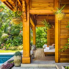Ornamental Wood Folly Featuring Spa-Like Lounge Chairs and Asian Decor 